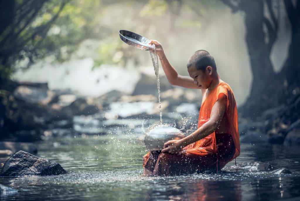 Shaolin monk performing water ritual in nature