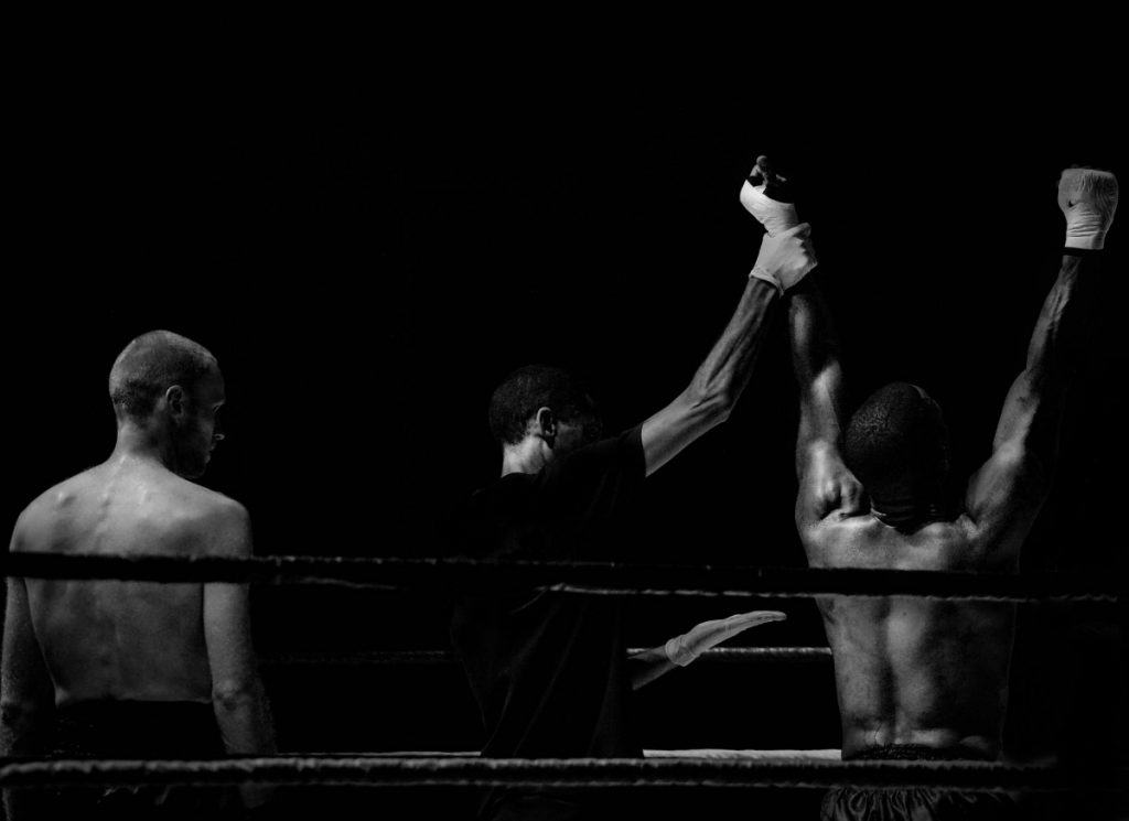 Fighter celebrating victory in the ring