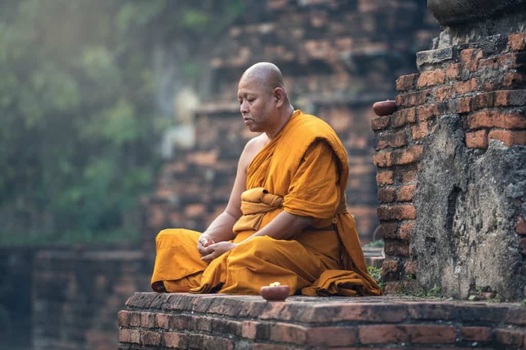 Buddhist monk sitting in meditation