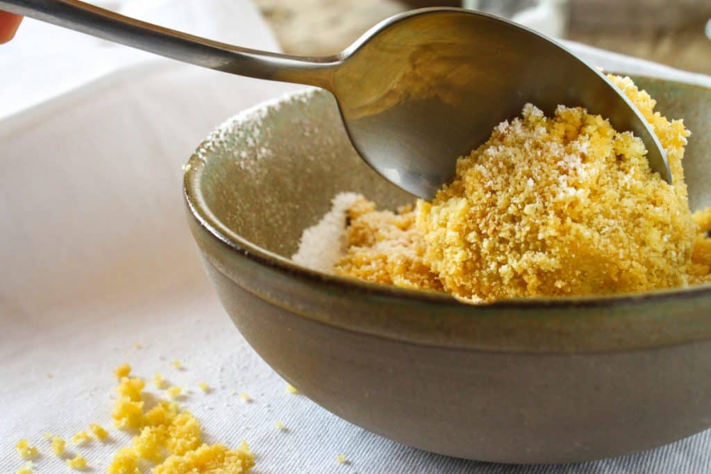 Nutritional yeast in a bowl with a spoon